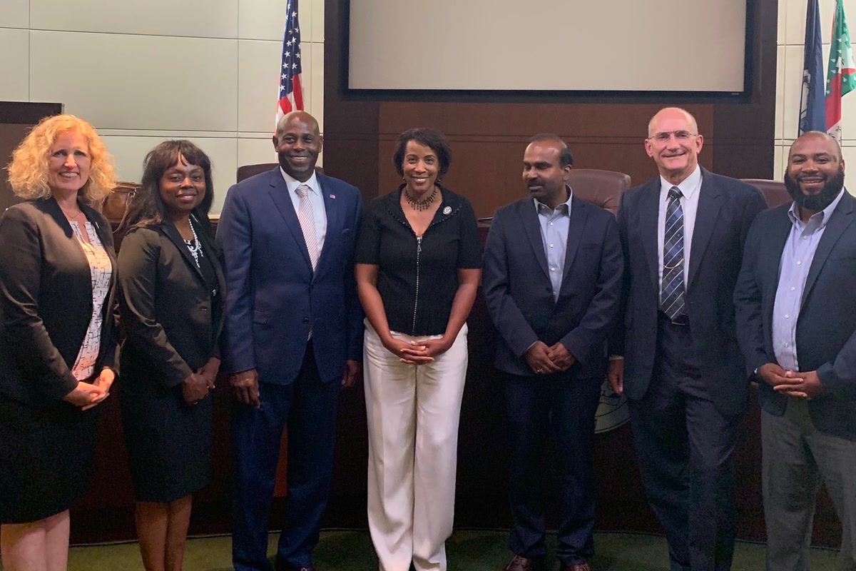 Forest Hayes with Loudoun County officials in the board room