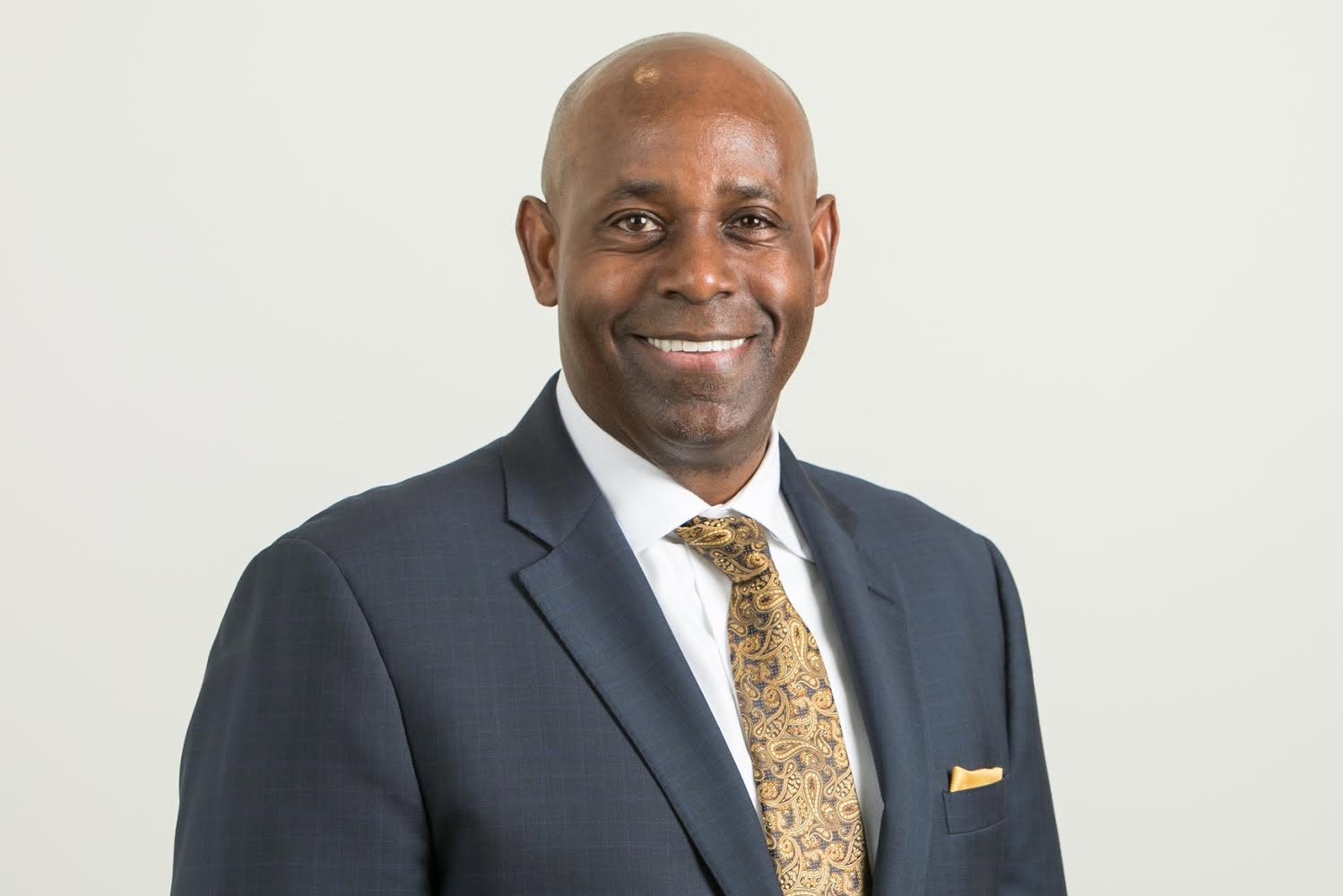 Forest Hayes headshot in a blue suit