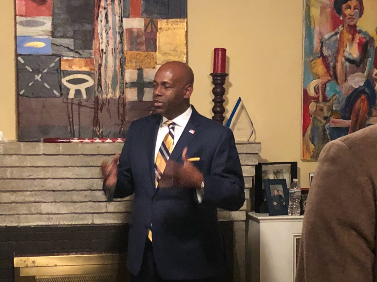 Forest Hayes speaking to supporters at a house party