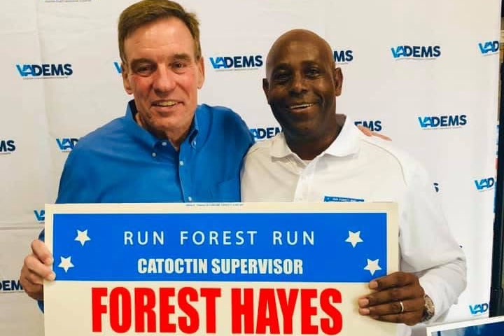Forest Hayes with Senator Mark Warner holding a Run Forest Run sign